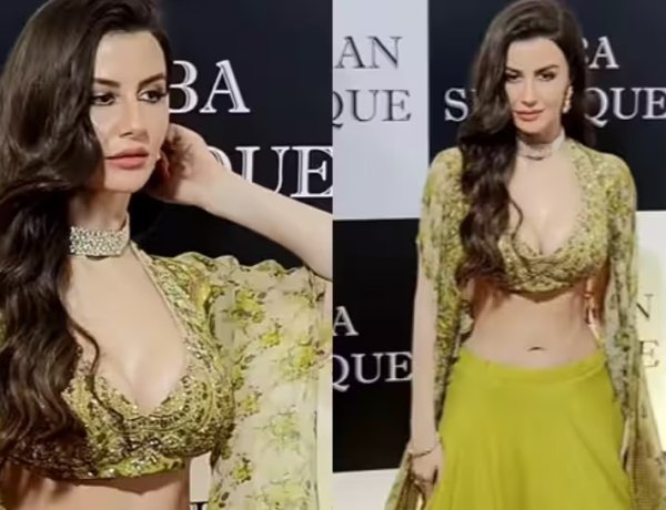 Giorgia Andriani stuns in a green lehenga with a deep neck choli and a long floral cape at Baba Siddiqui`s annual Iftar party