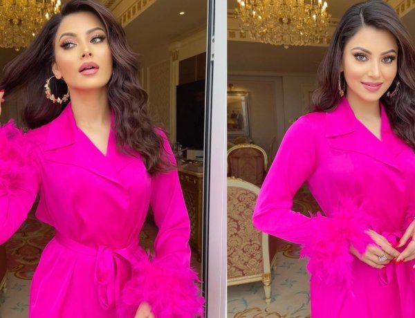Urvashi Rautela Radiates Charm in Elegant Silk Feather Fuchsia Pink Dress